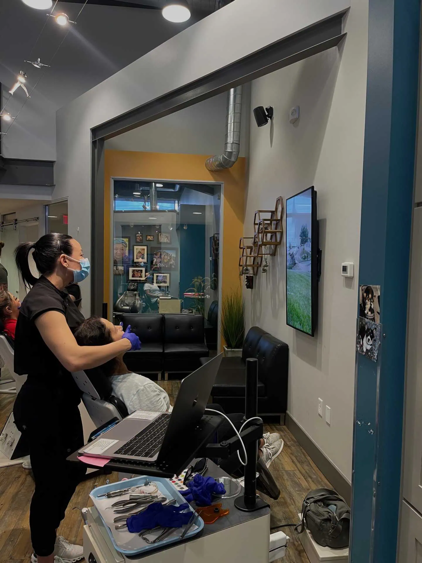 Team member examining patient's teeth
